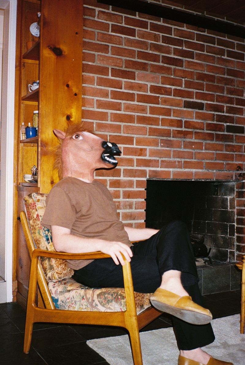 Travis wearing a horse mask for no reason.
